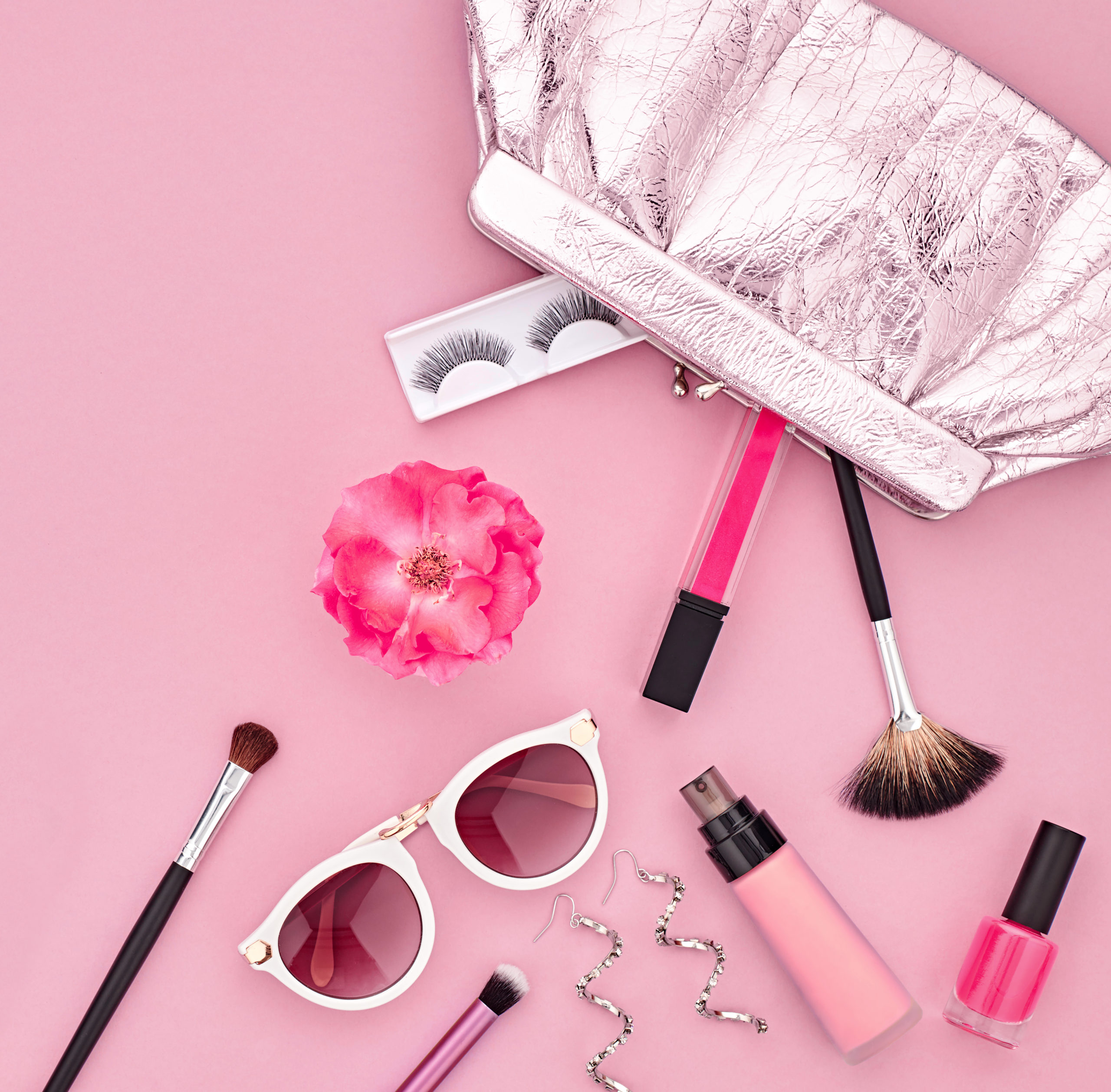 Fashion Makeup Cosmetic Set. Woman Beauty Accessories Set. Makeup Essentials. Fashion Design. Lipstick Brushes Eyeshadow, fashion Glamor Stylish Clutch. Rose.Minimal Concept.Top view.Cosmetic Overhead